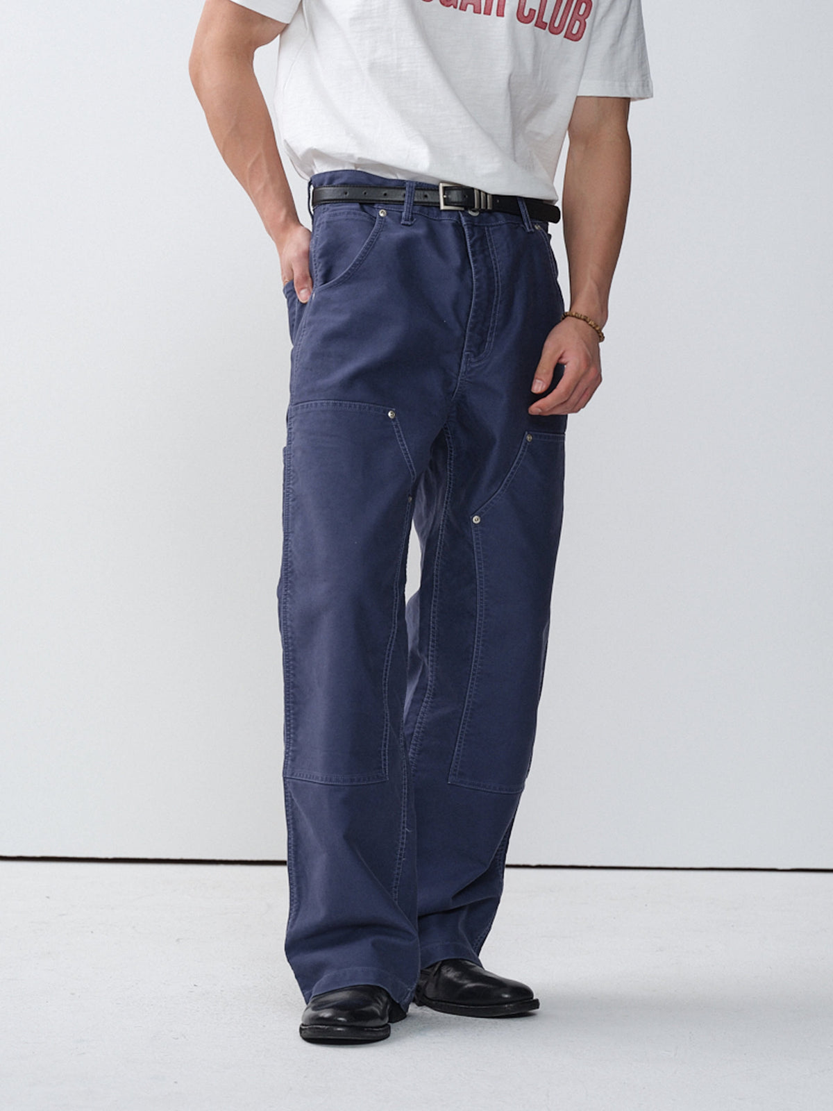 Model wearing blue cotton moleskin double-knee pants