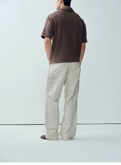 Model wearing white cotton moleskin double-knee pants - back view