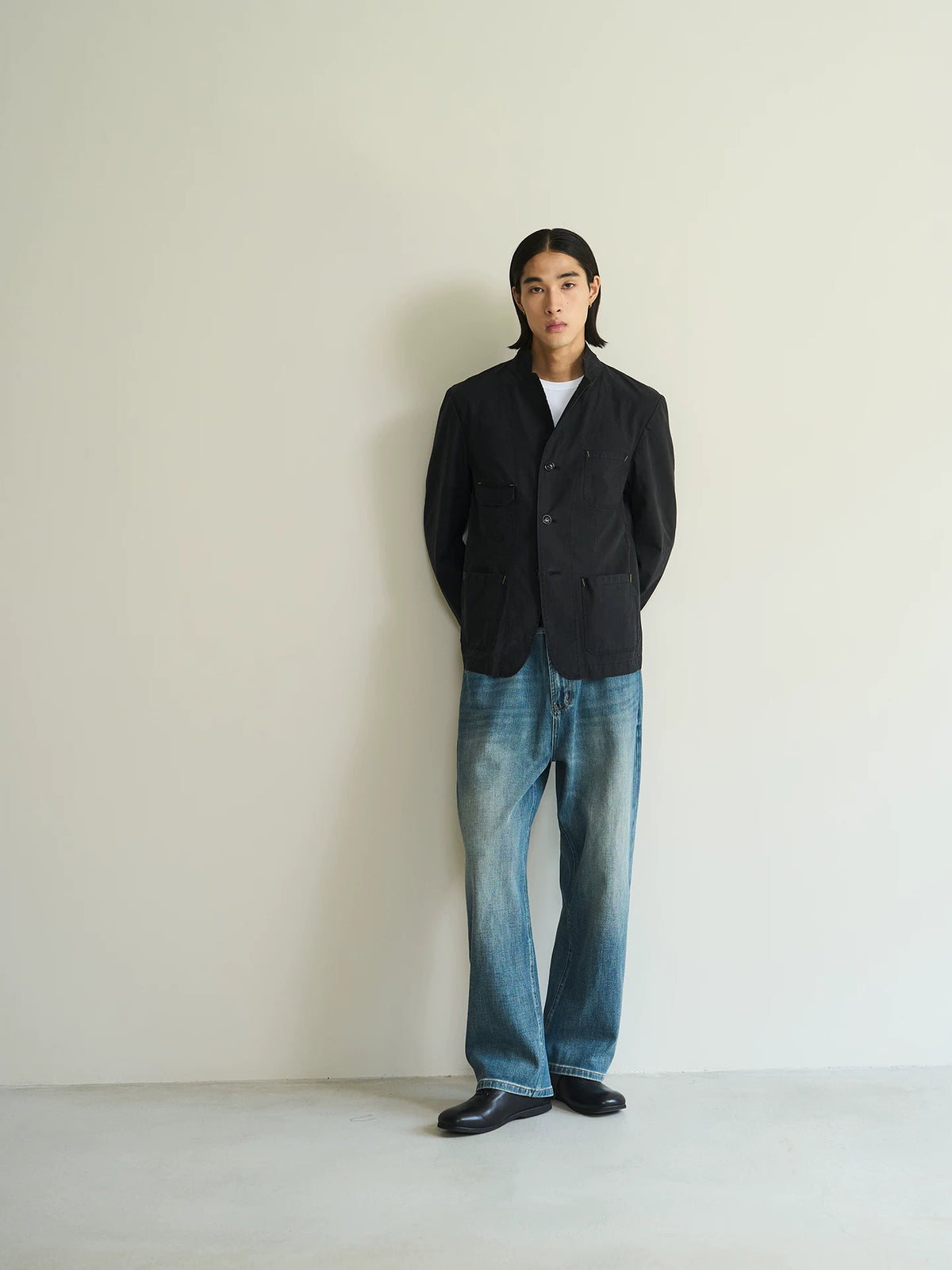 Black cotton utility blazer, full-length front view on model