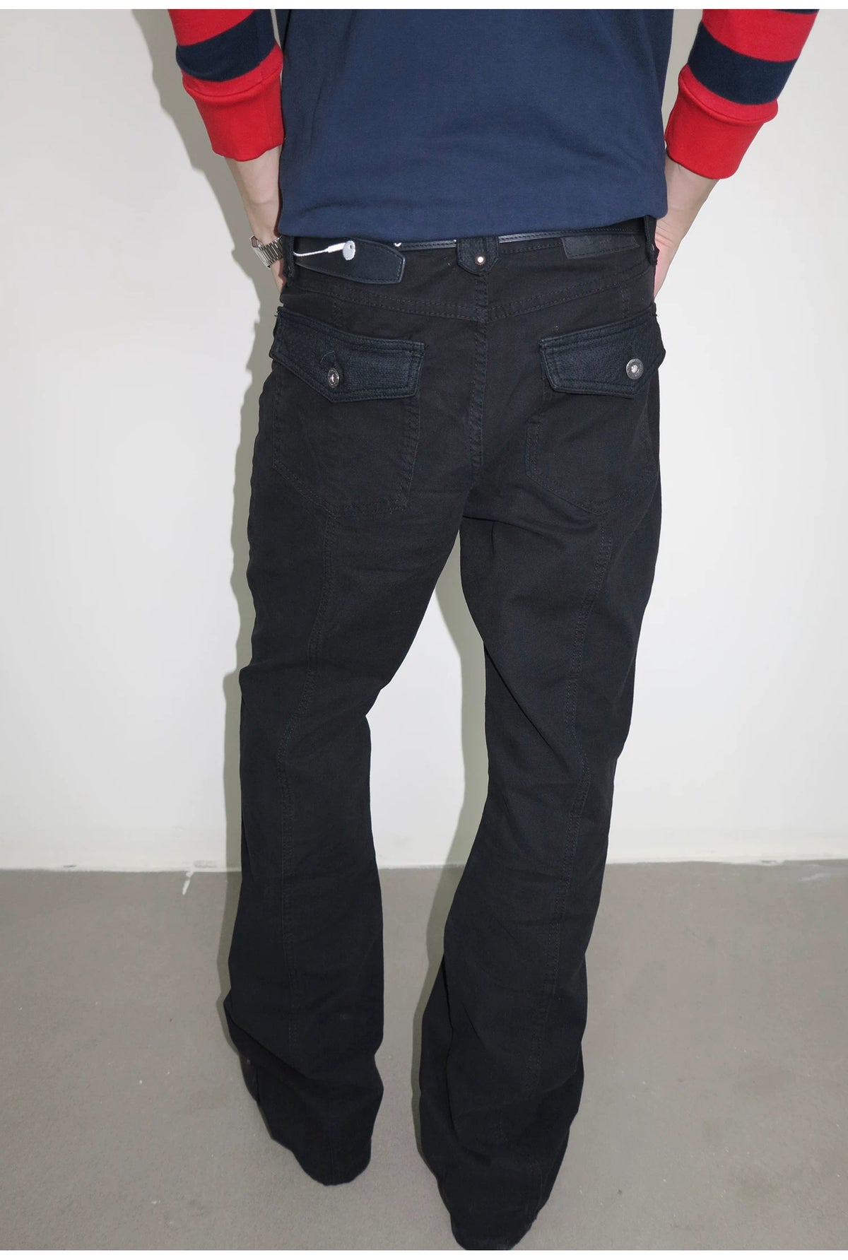 Black jeans, back view on model
