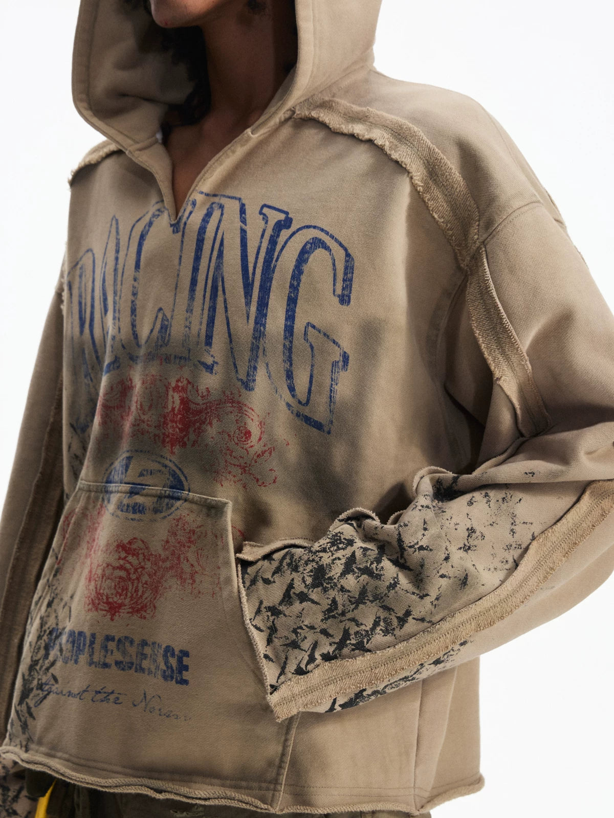 Khaki sweatshirt, close view of graphic and contrast sleeve