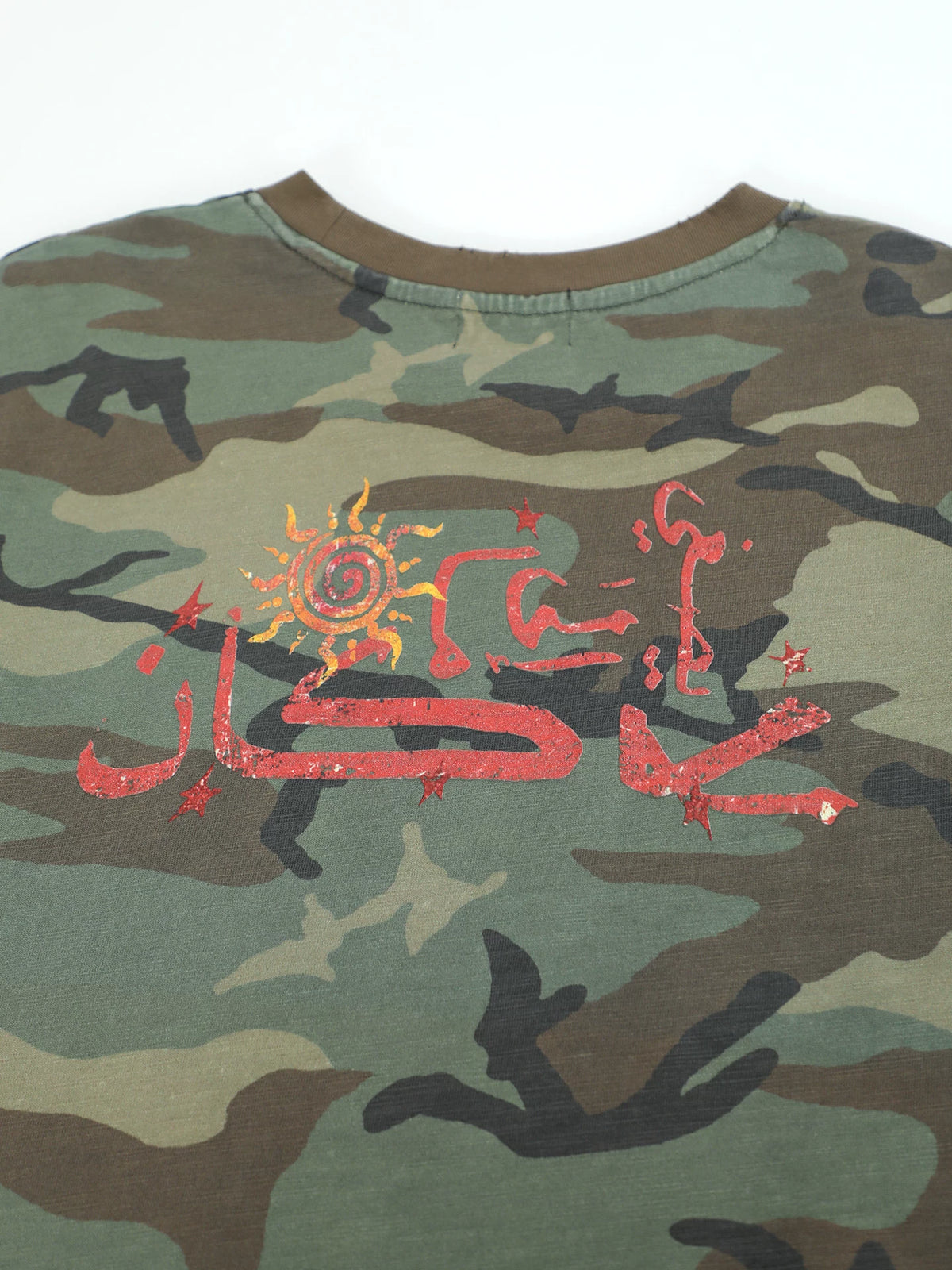 Close-up of the red back graphic on the camouflage shirt