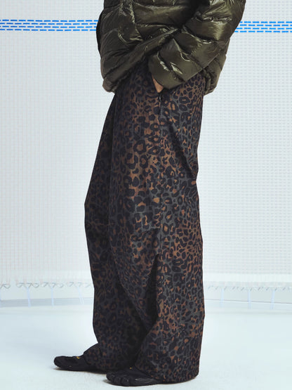 Brown leopard parachute pants shown from the side