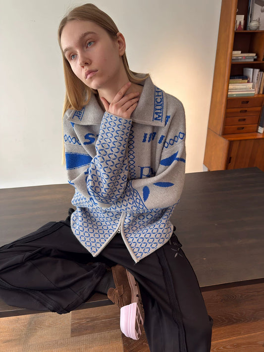 Light grey jacquard cardigan worn from the front
