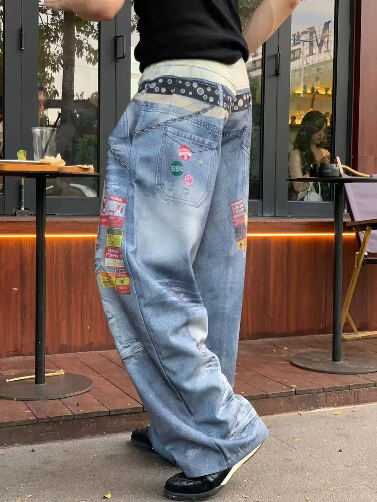 Light blue jeans, back view showing rear pockets and patches