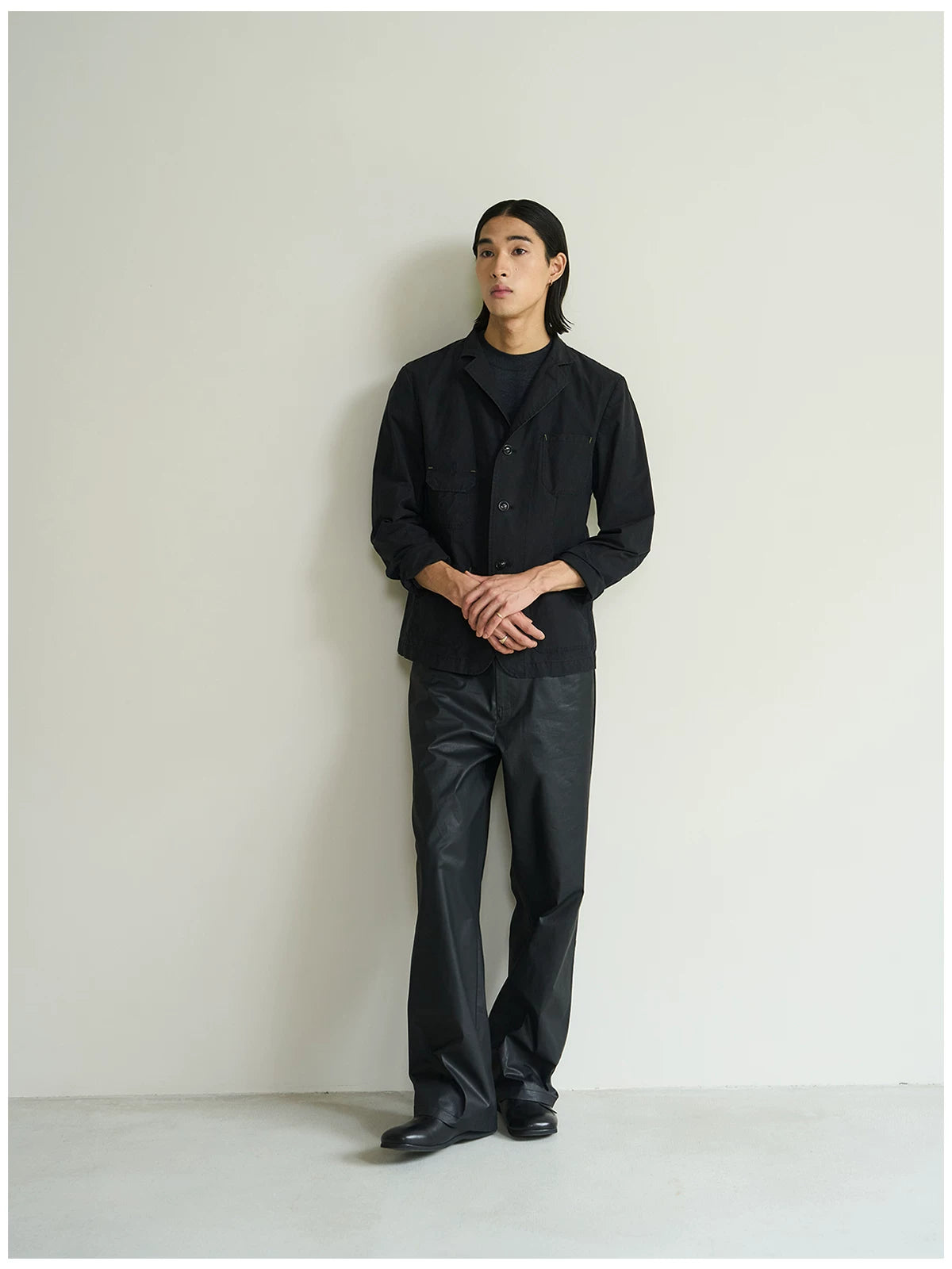 Black cotton utility blazer, three-quarter full-length view on model
