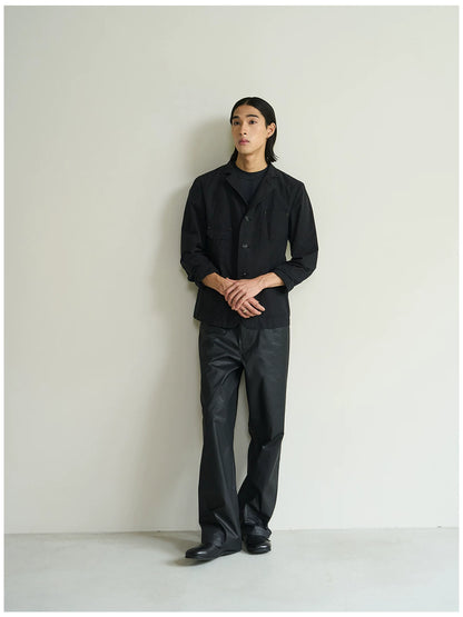 Black cotton utility blazer, three-quarter full-length view on model