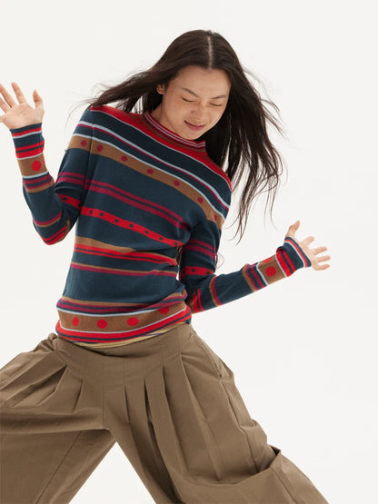 Striped knit sweater in navy, red and green, front pose