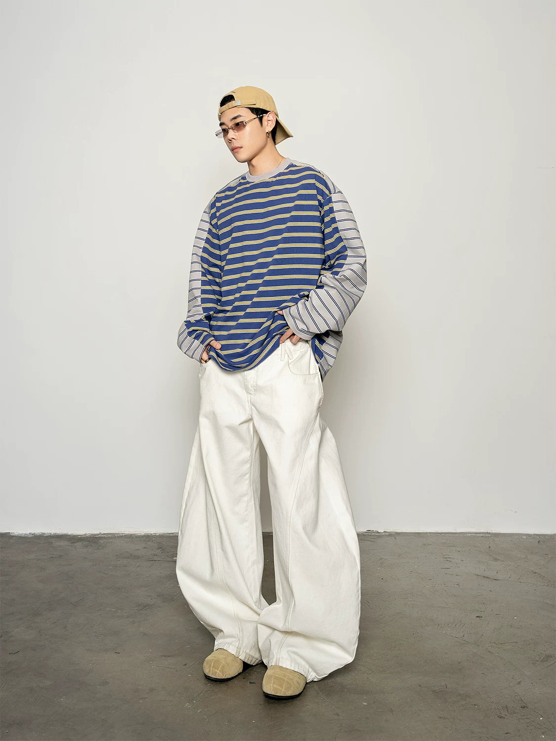 Blue and yellow striped long-sleeve T-shirt, full-length three-quarter view on model