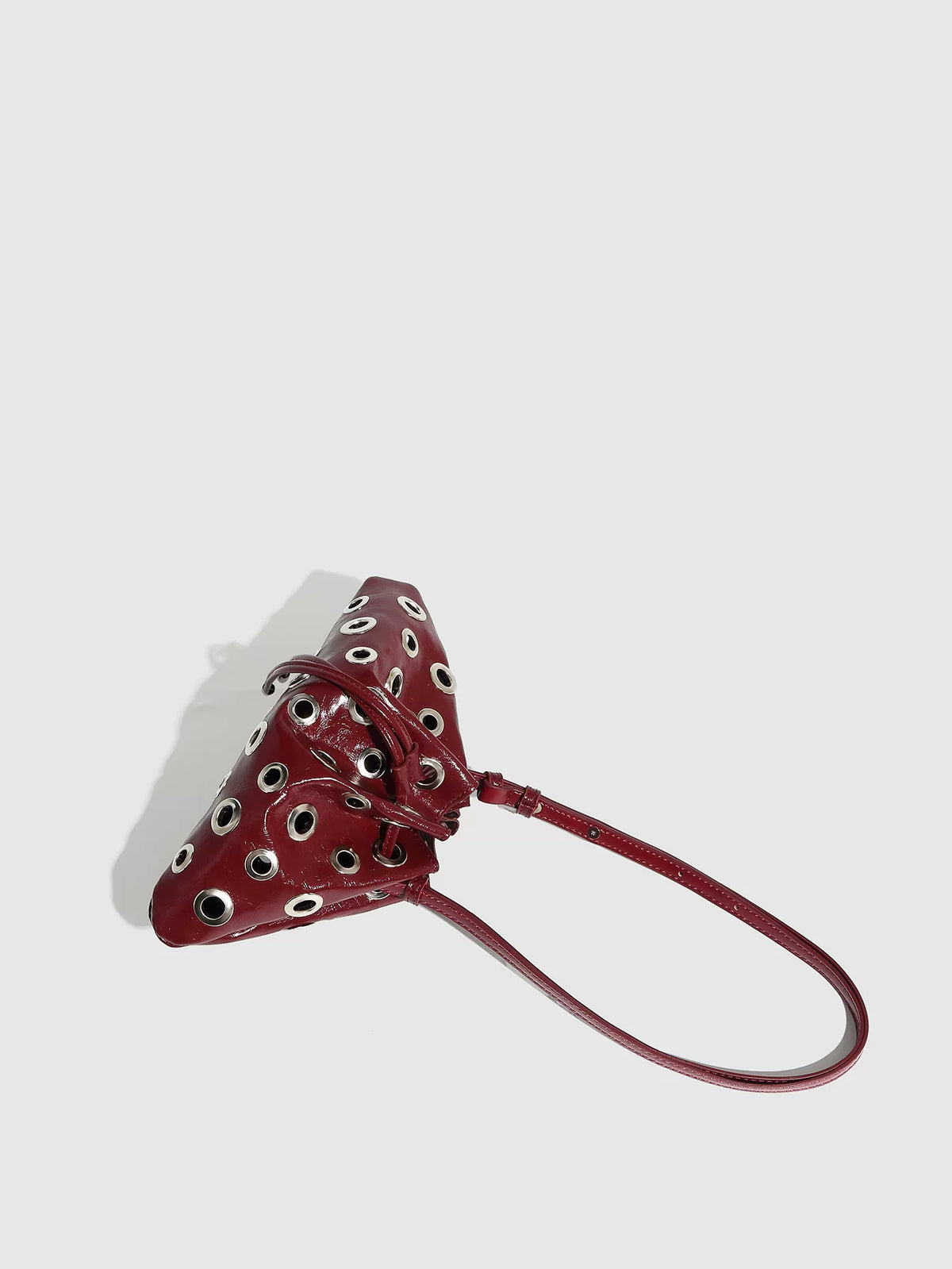 Eyelet Studded Drawstring Shoulder Bag product photo