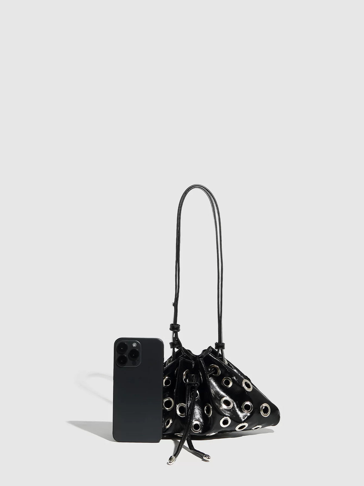 Eyelet Studded Drawstring Shoulder Bag product photo