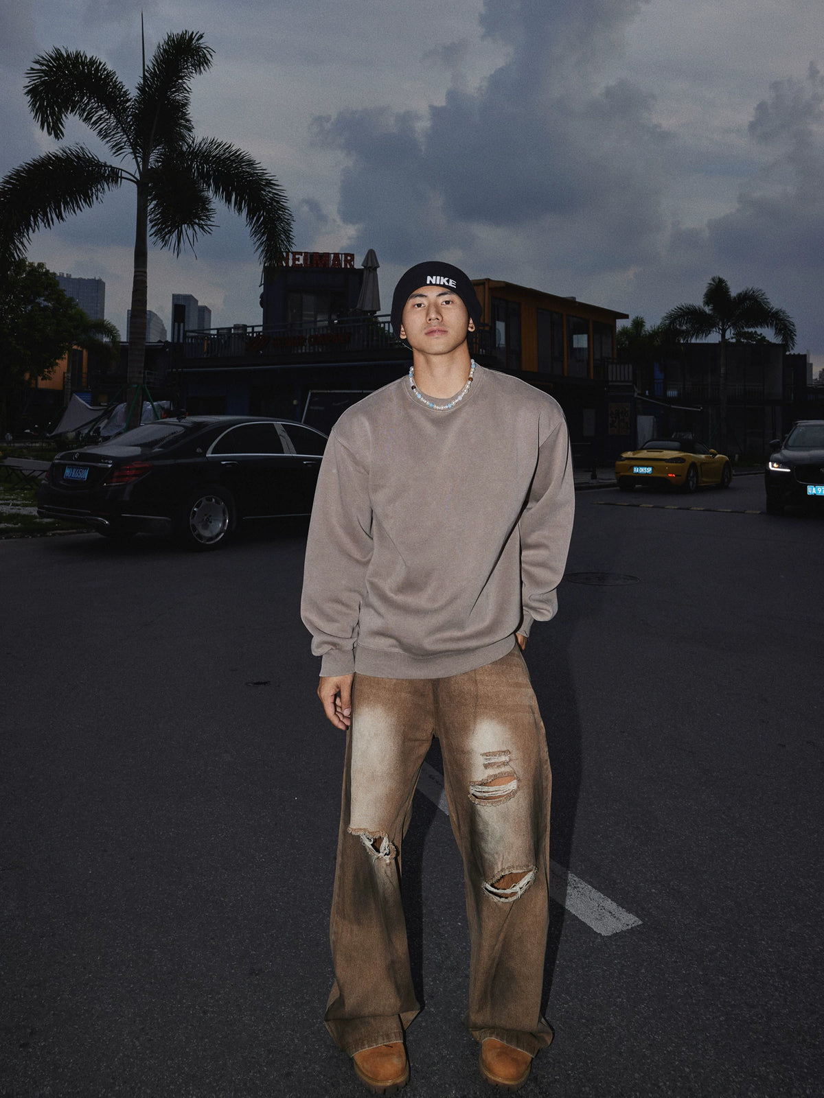 Taupe crewneck sweatshirt, full-length front view on model