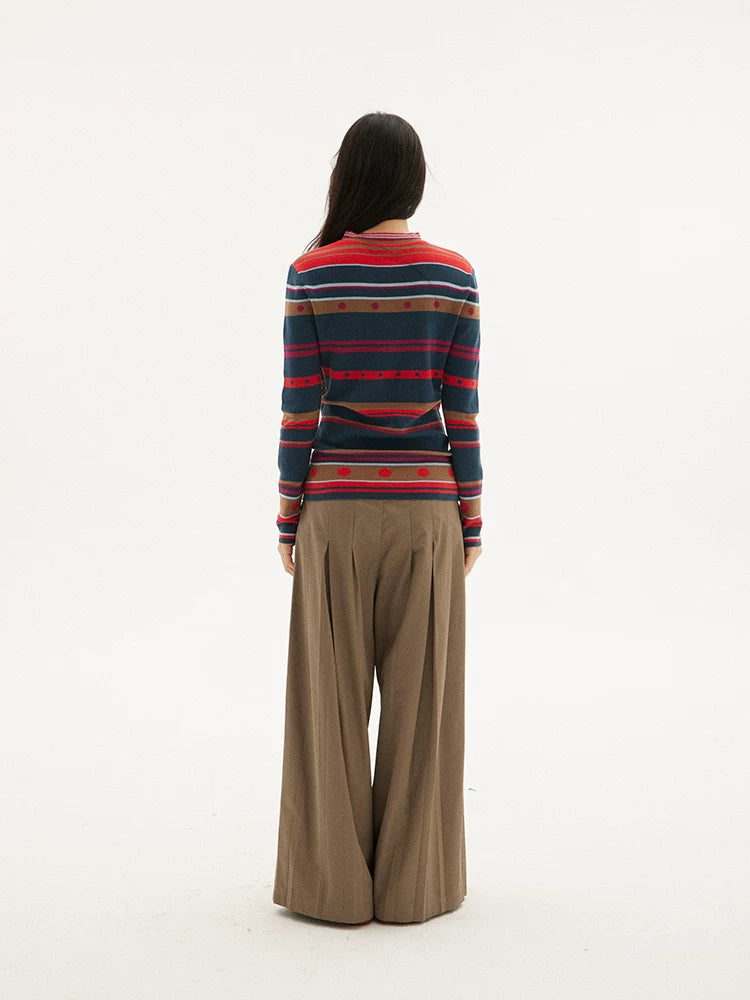 Striped knit sweater in navy, red and green, back view