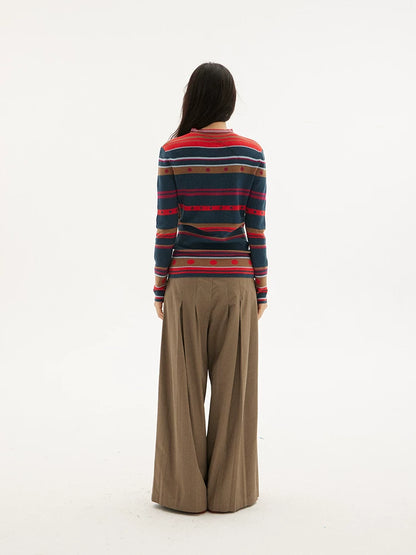Striped knit sweater in navy, red and green, back view