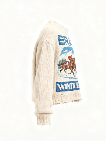 Side view of an off-white distressed knit sweater with a blue front graphic