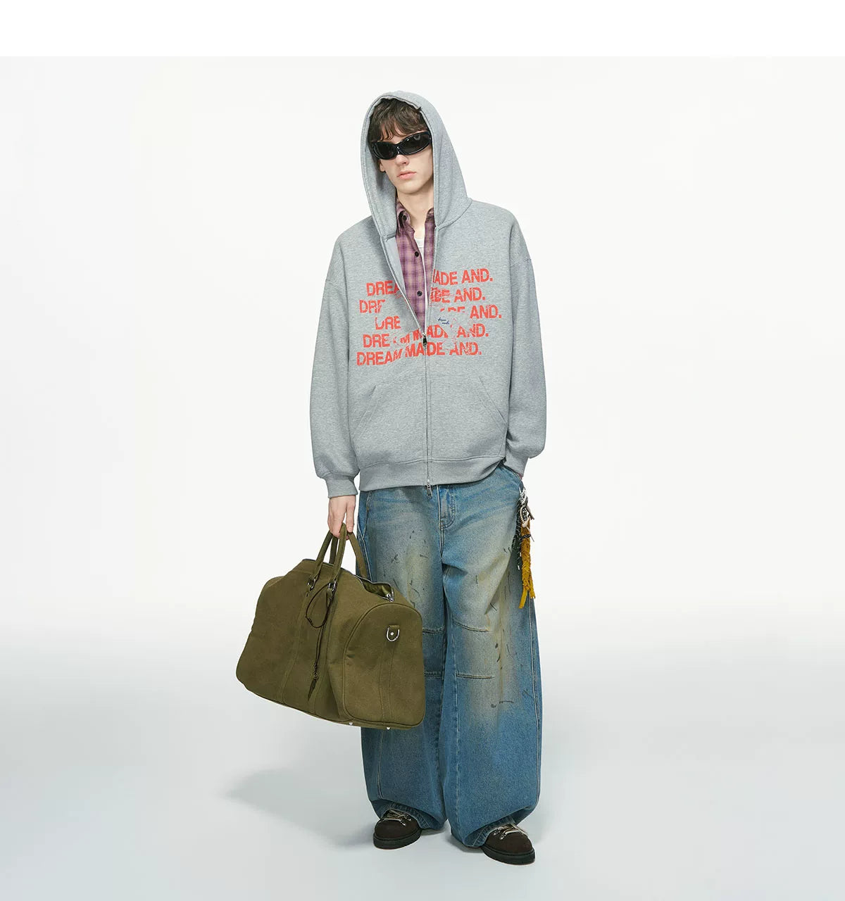 Light gray zip hoodie with red printed text, worn on model, front view