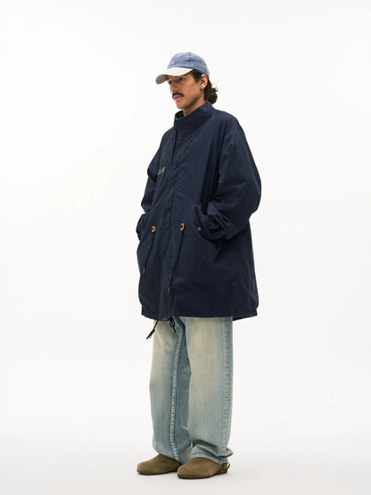 Navy M65 fishtail parka worn on model, side view
