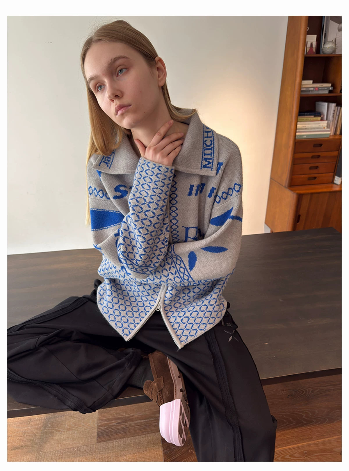Light grey patterned cardigan worn from the front
