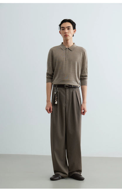 Full outfit with brown leather belt, taupe knit and pleated trousers