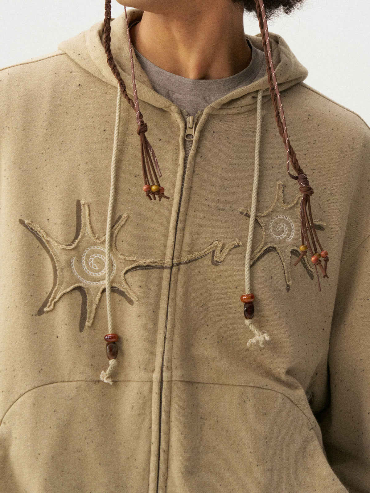 Khaki hoodie, close-up of raised chest stitching