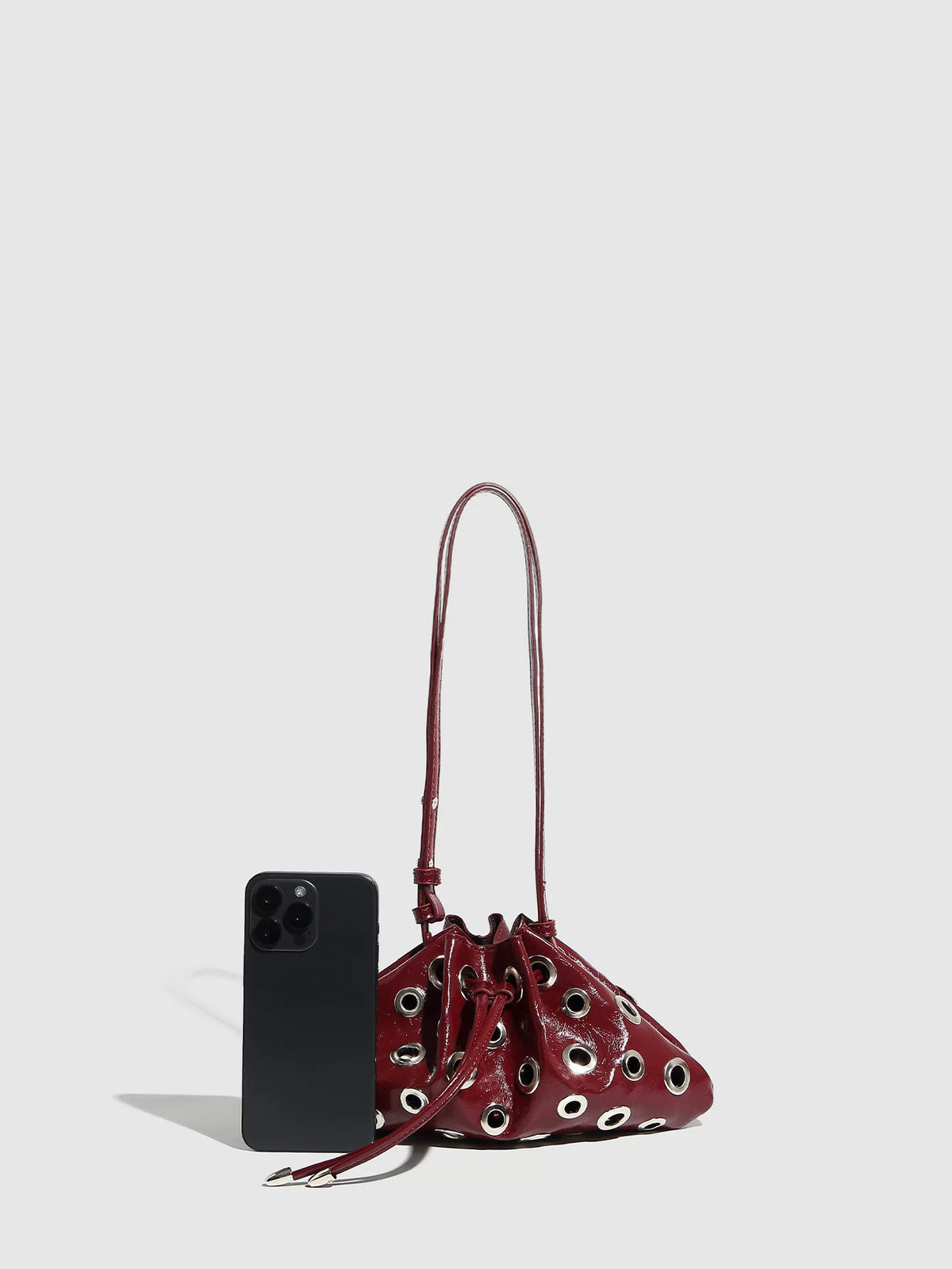 Eyelet Studded Drawstring Shoulder Bag product photo