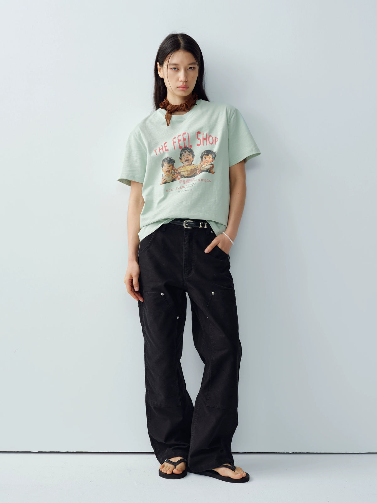 Model wearing black cotton moleskin double-knee pants