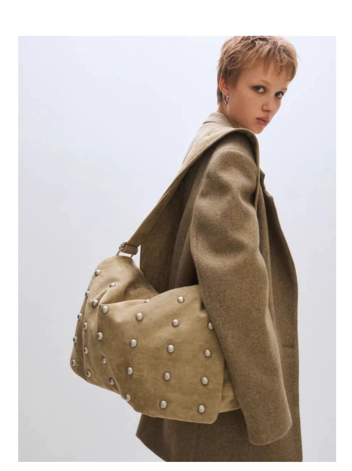 Studded Wide Strap Large Capacity Shoulder Bag in sand worn on the shoulder