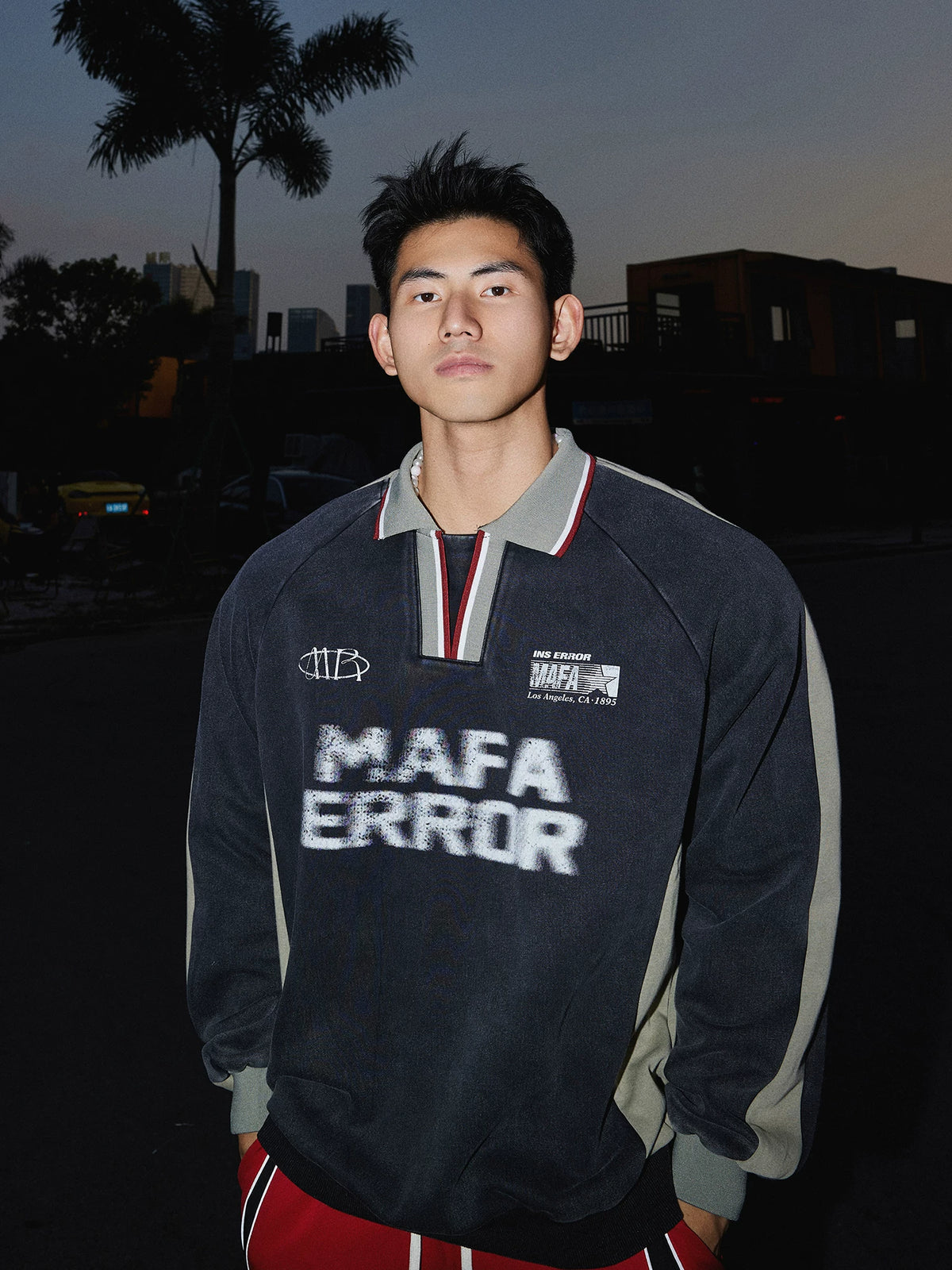 Charcoal pullover sweatshirt with gray sleeves, front view on model