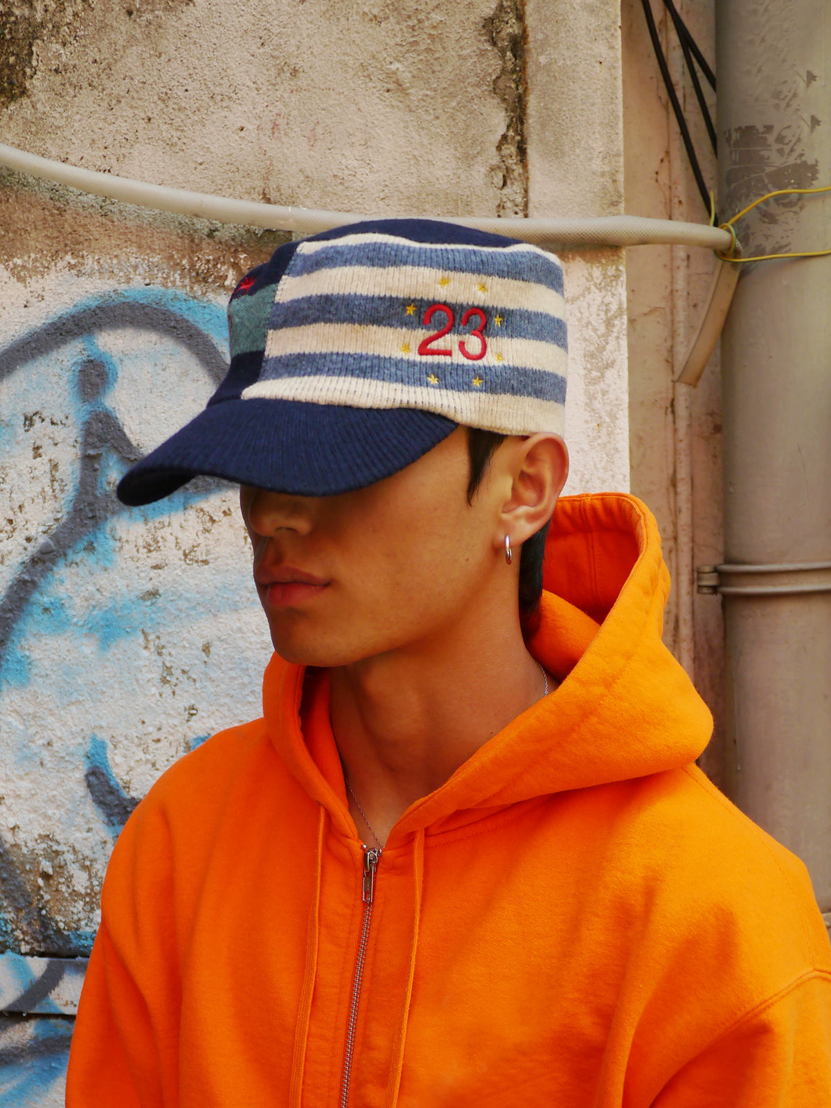 Embroidered Curved-Brim Knit Cap in Navy and Brown color