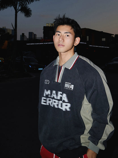 Charcoal pullover sweatshirt with gray sleeves, three-quarter front view on model