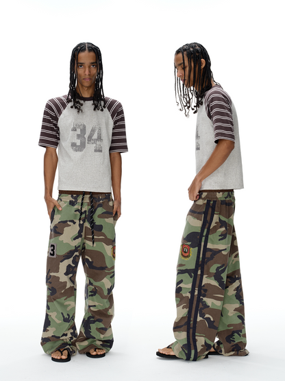 Camouflage pants with double-waist detail, full front view