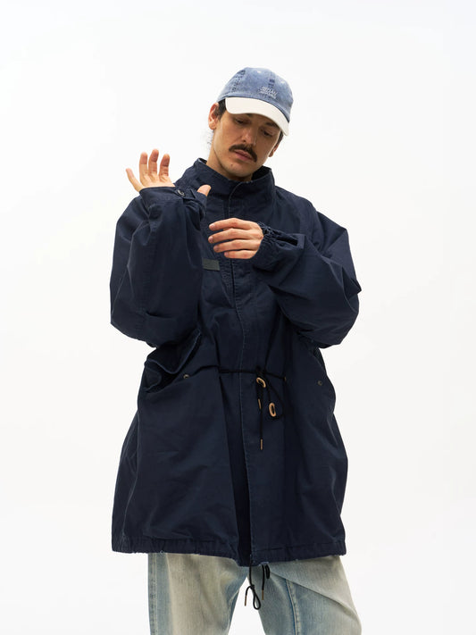 Navy M65 fishtail parka worn on model, front detail view