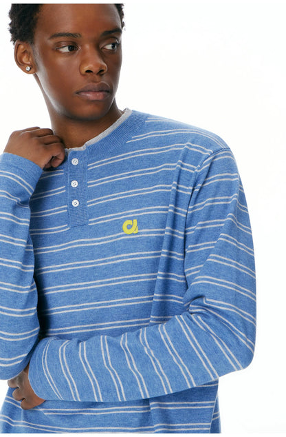 Close-up of the blue Henley collar and button placket
