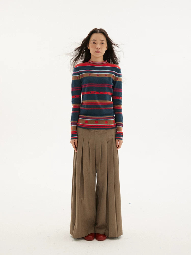 Striped knit sweater in navy, red and green, front view