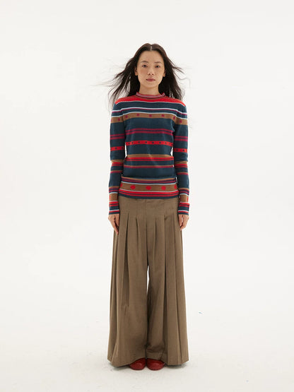 Striped knit sweater in navy, red and green, front view