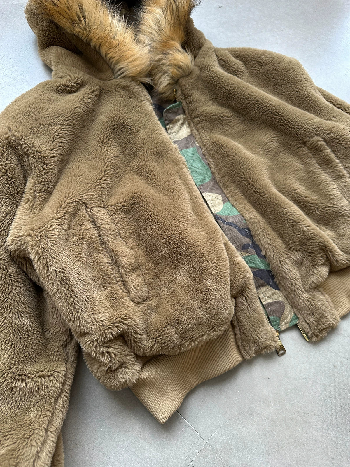 Brown faux-fur jacket laid flat