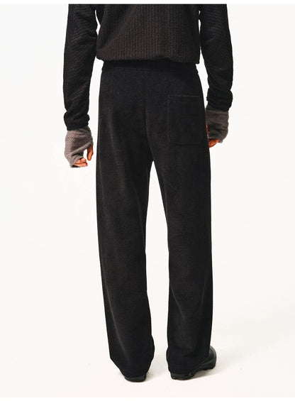 Black waffle-knit pants, back view