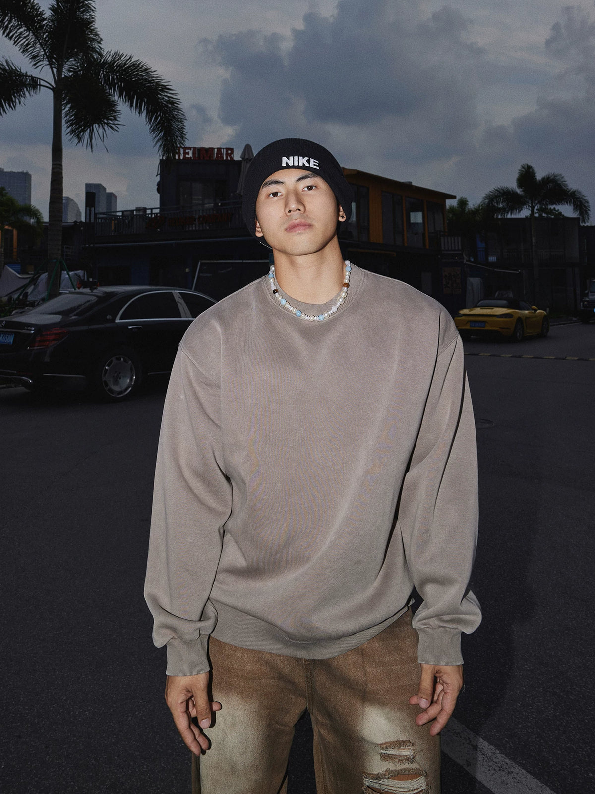 Taupe crewneck sweatshirt, front view on model