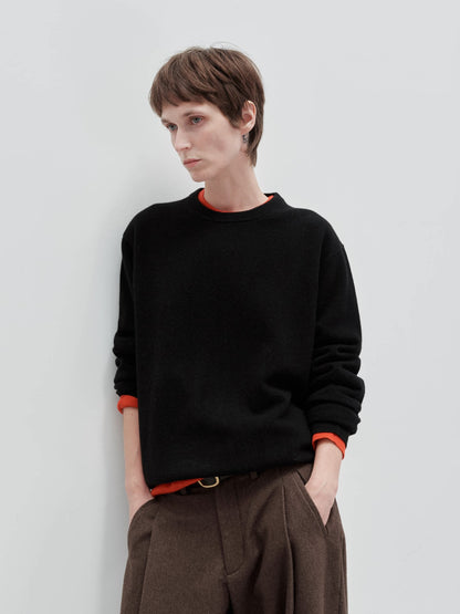 Wool cashmere crewneck sweater, model wearing black crewneck sweater