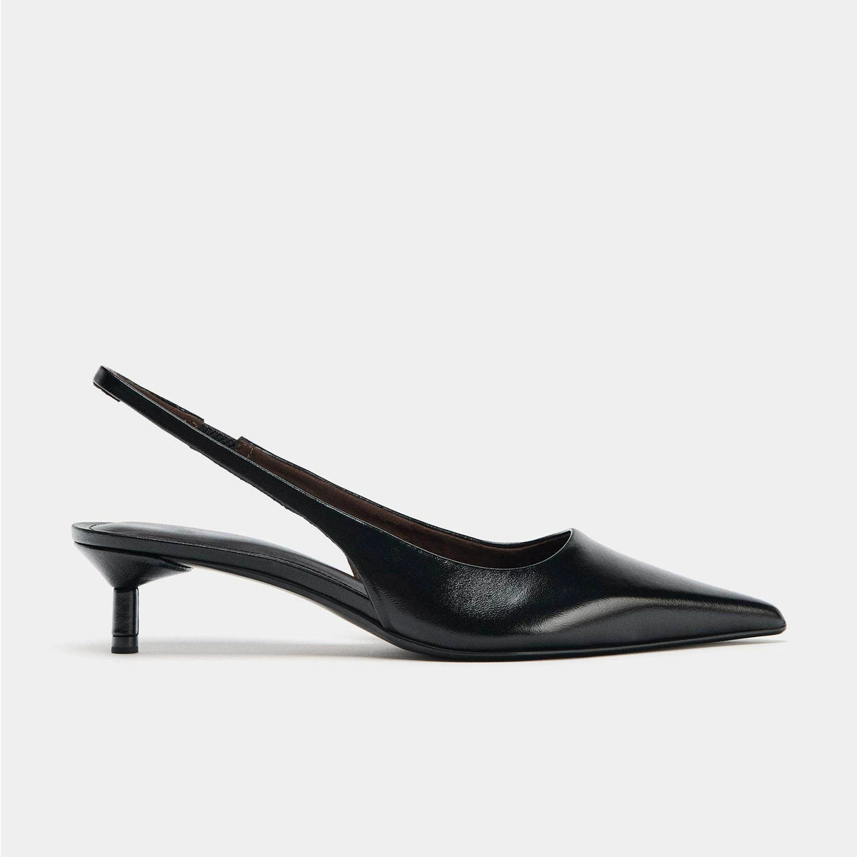 Black pointed-toe kitten-heel slingback pump, side view