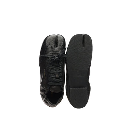 Black Tabi split toe sneakers with sole view