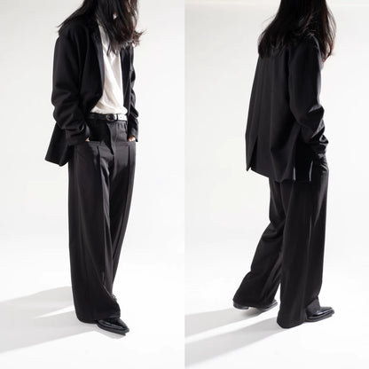 Botanical Embroidered Loafers — black embroidered loafers worn with long trousers
