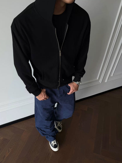 Black zip-up hoodie, front view on model