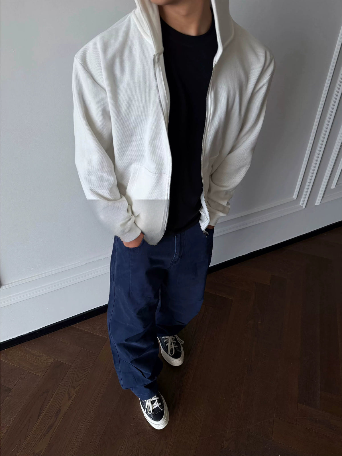 White zip-up hoodie, front view on model