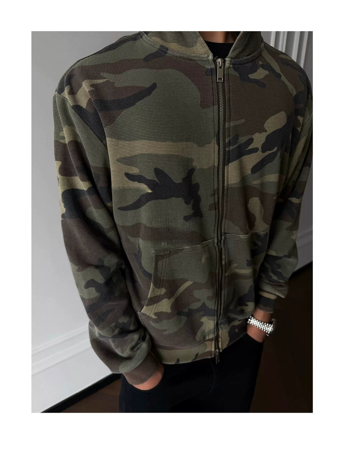 Green camouflage zip-up hoodie, front view on model