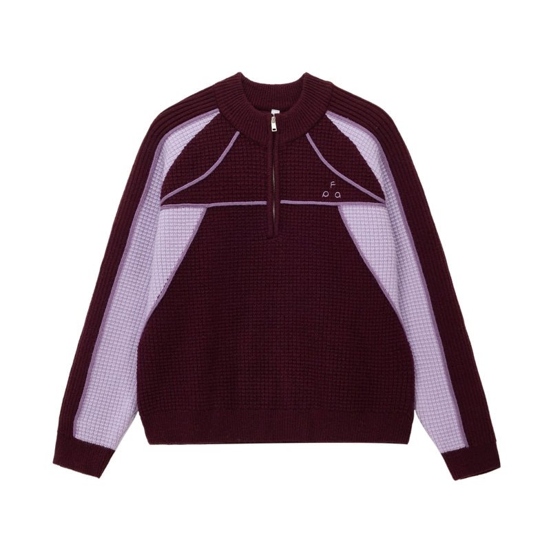 The EastLyst Color Block Half Zip Sweater features a navy and white geometric design with blue accents, long sleeves, a textured knit, and premium warmth—perfect for autumn and winter.
