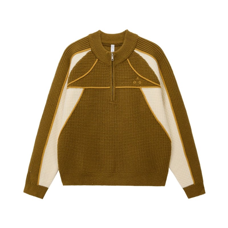 The EastLyst Color Block Half Zip Sweater features a navy and white geometric design with blue accents, long sleeves, a textured knit, and premium warmth—perfect for autumn and winter.