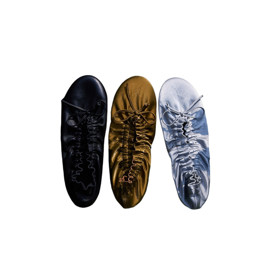 Crinkled Lambskin Folding Ballet Flats — silver, black and bronze pairs, top view