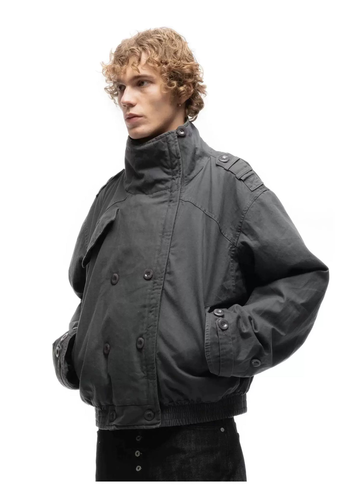 Cropped Parka Jacket — Model wearing grey jacket with hands in pockets