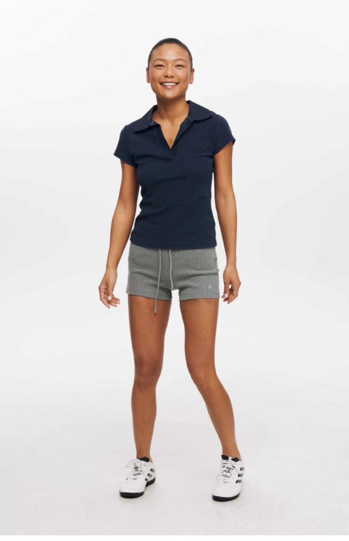 Slim Fit Tennis Top — worn by a model